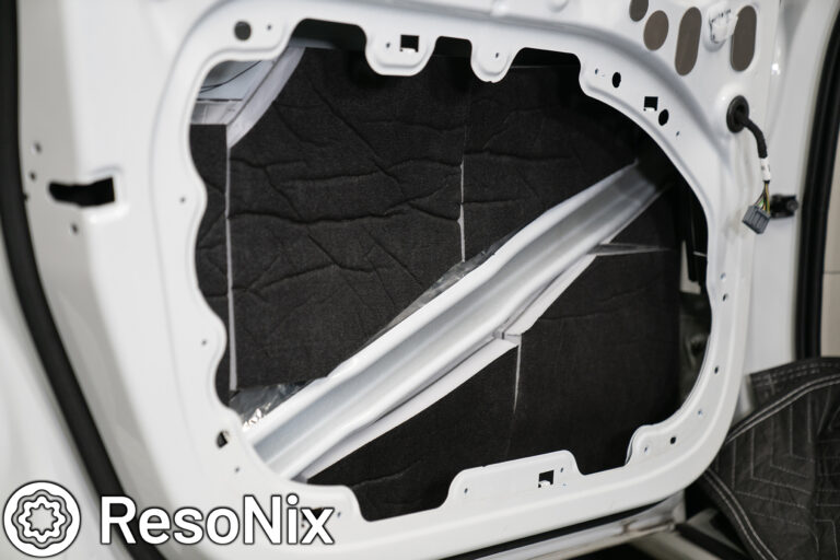Volvo S60 R Design door with ResoNix Guardian Hydrophobic Melamine and MLV Material applied to the outer door skin to absorb the speakers rear wave for distortion and resonance reduction, and to absorb and block outside road, wind, and tire noise