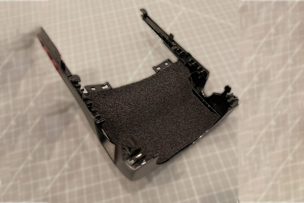 ResoNix Sound Solutions CCF Decoupler 7S Sound Deadening Foam and vibration decoupler installed into the rear of an overhead console trim to reduce rattles in a car