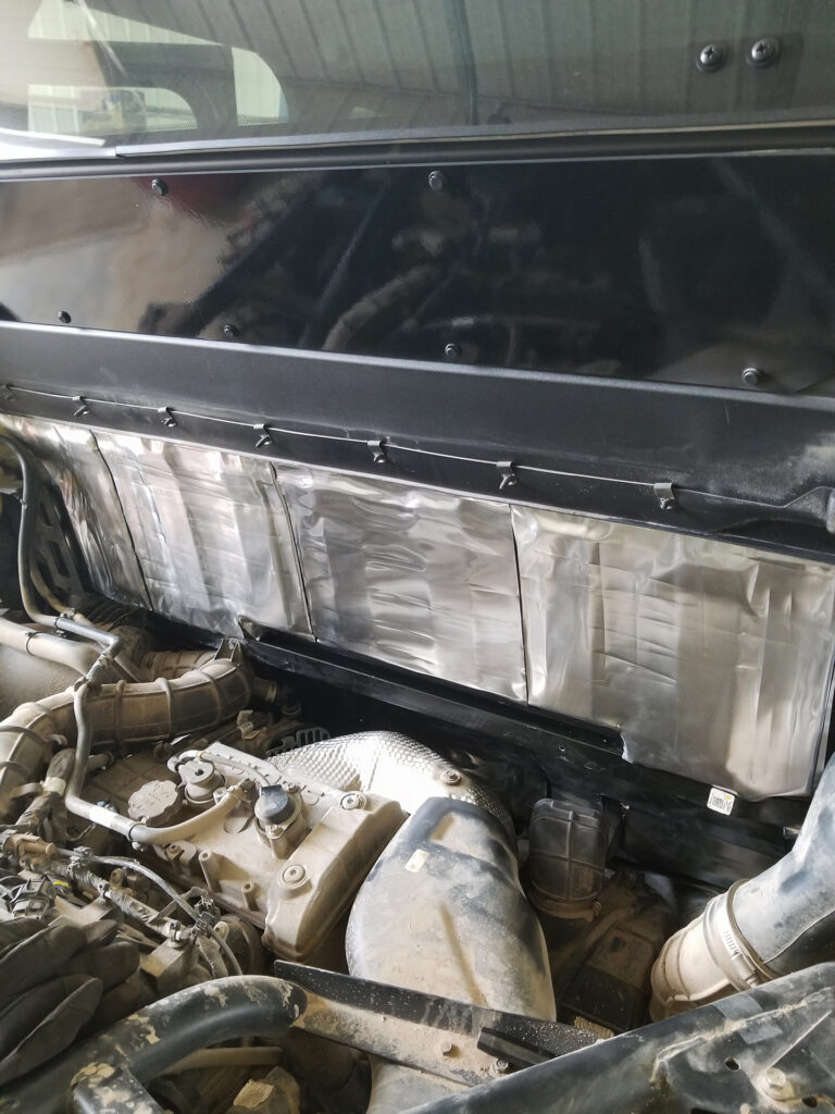 ResoNix Sound Solutions Mega CLD Squares Sound deadening material installed onto the exterior firewall of a Polaris Xpedition to reduce sound from the engine